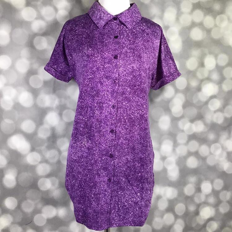 Front view of mannequin wearing LuLaRoe Charlie Button Up Shirt in purple nonprint textured design with short sleeves and button front