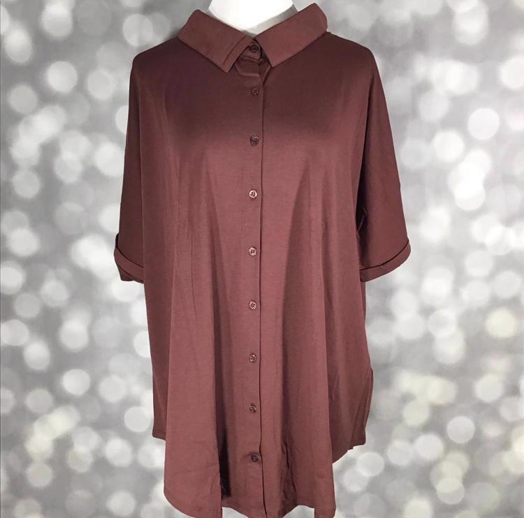 Front view of mannequin wearing LuLaRoe Charlie Button Up Shirt in solid brown with rolled short sleeves and button front