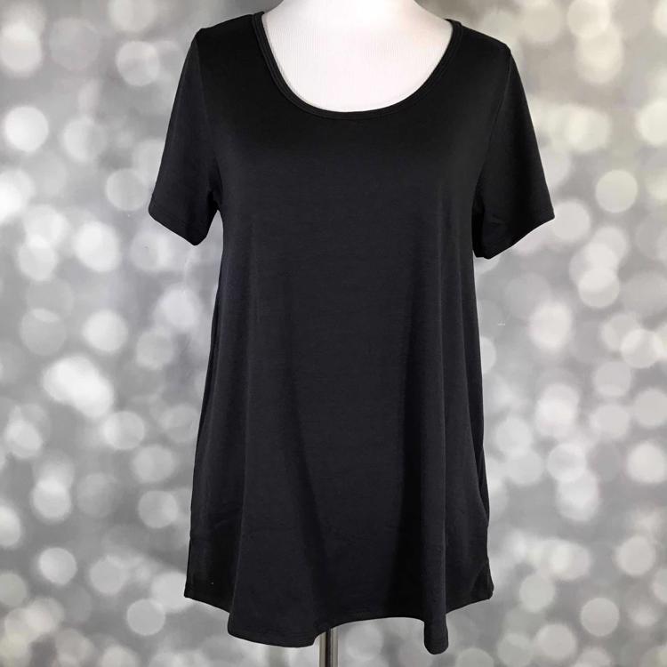 Front view of LuLaRoe Classic T on mannequin in solid black, featuring short sleeves, scoop neckline, and flattering longer back hem