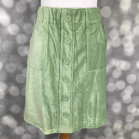 Addie Corduroy Skirt in Loden Frost Green by LuLaRoe displayed front view, featuring a chic faux button front, patch pockets, and a soft, textured finish, perfect for stylish and comfortable fall outfits.