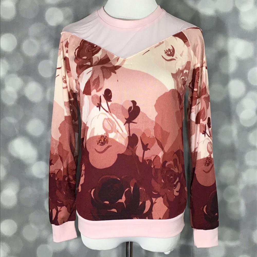 LuLaRoe Lizzy Sweater in blush and burgundy floral print with pink mesh yoke, ribbed cuffs, and lightweight hacci knit fabric on a mannequin against a blurred background