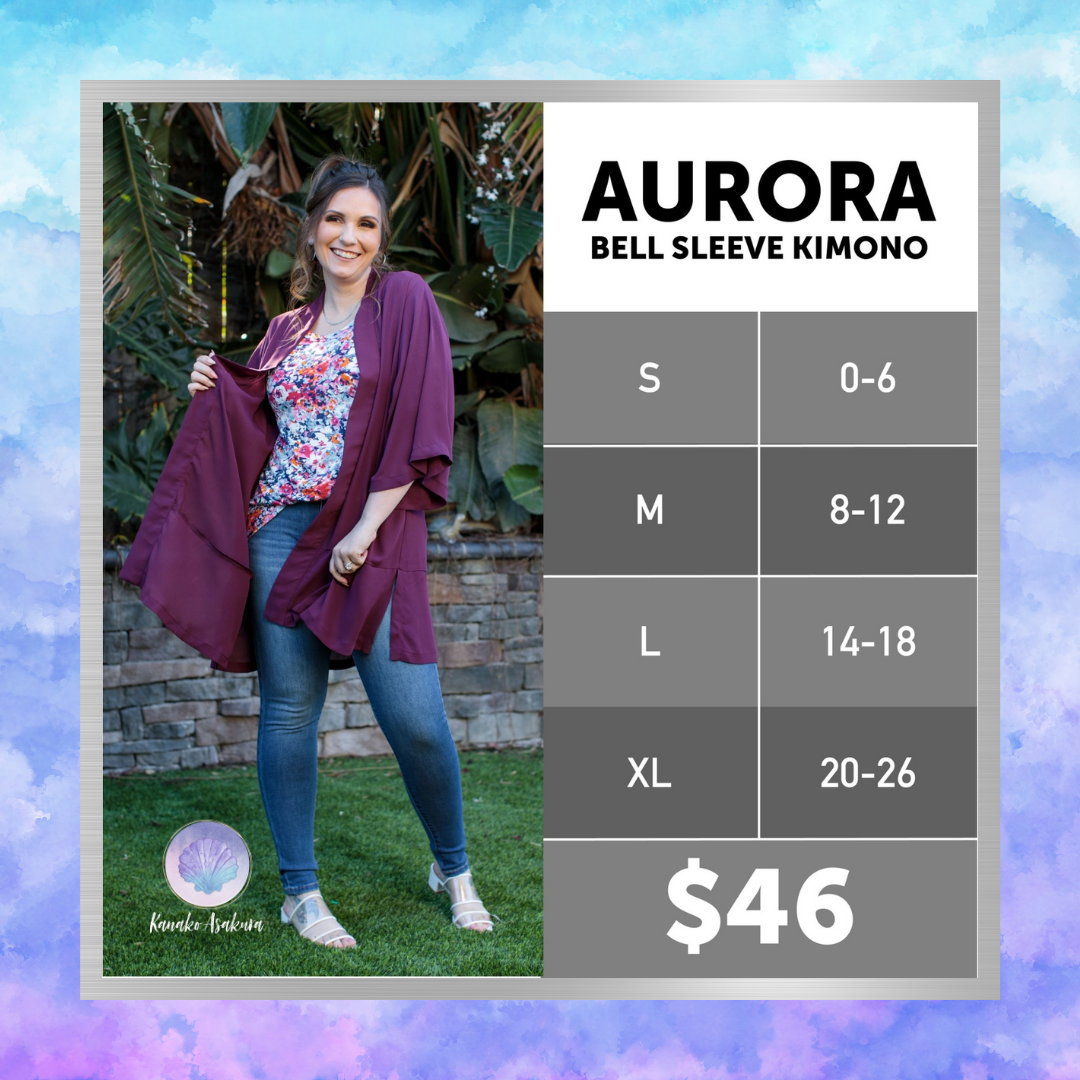 Model wearing a LuLaRoe Aurora bell sleeve kimono in solid burgundy wine layered over a floral top and denim jeans, showing the flowy open-front silhouette and wide bell sleeves with a size chart and pricing.
