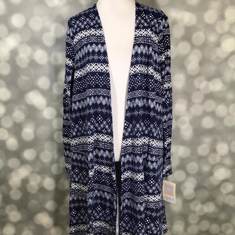 LuLaRoe Caroline Cardigan in navy blue with white fair isle print, mid-thigh length with pockets, cozy layering piece.