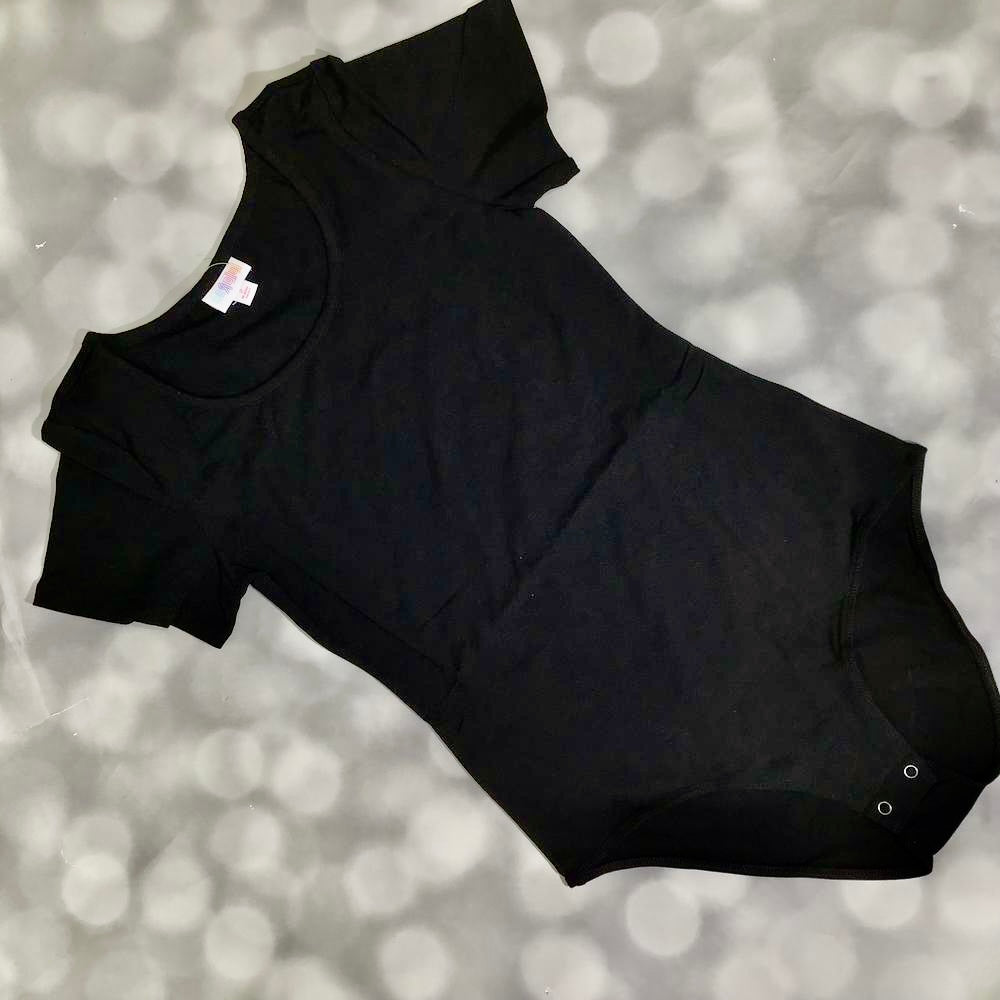LuLaRoe Faith Bodysuit in solid black with short sleeves, scoop neckline, and snap closure