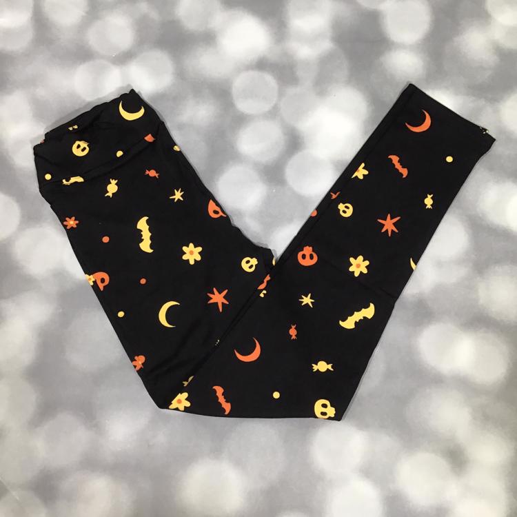 LuLaRoe black Halloween leggings with pumpkins, bats, candy, stars, and moon print
