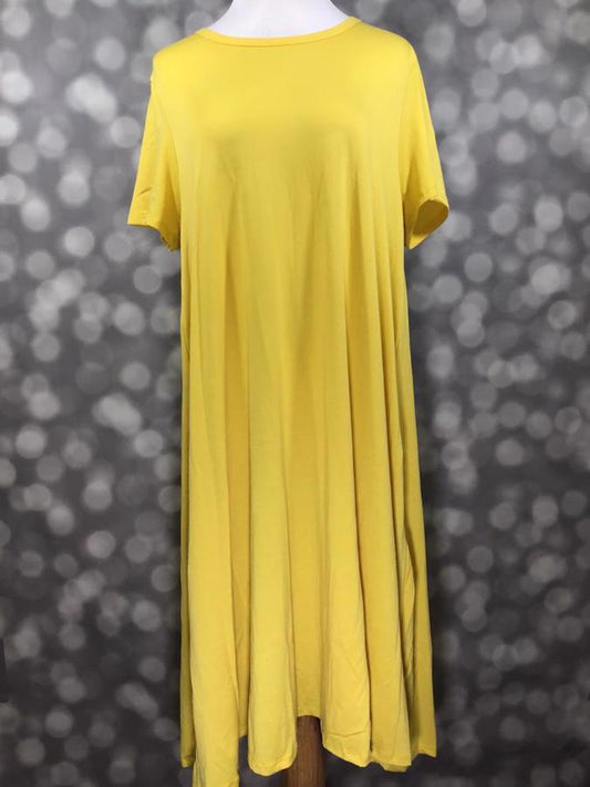 Front view of LuLaRoe Jessie dress on mannequin in goldfinch yellow fabric featuring scoop neckline, short sleeves, and flowy swing hemline with hidden pockets