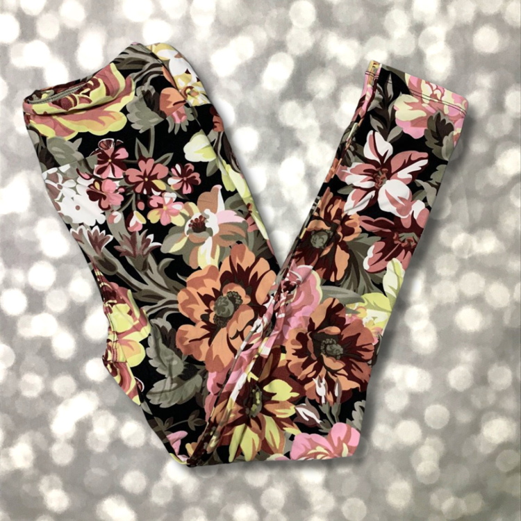 LuLaRoe leggings in black with oversized fall floral print in orange, blush, cream, and yellow tones.