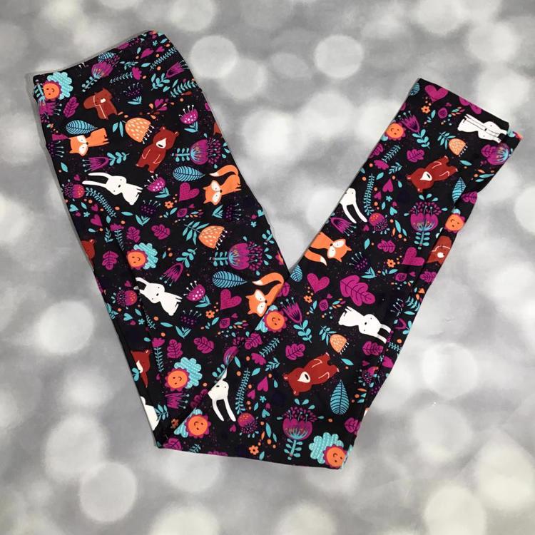 LuLaRoe leggings in black with colorful woodland animal and floral print featuring foxes, rabbits, and vibrant flowers
