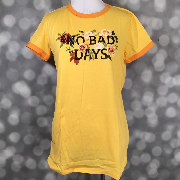 LuLaRoe Liv Tee in yellow with “NO BAD DAYS” floral graphic print on front