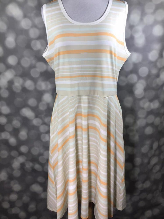 LuLaRoe Nicki sleeveless dress in soft pastel stripes of peach, mint, and cream on mannequin