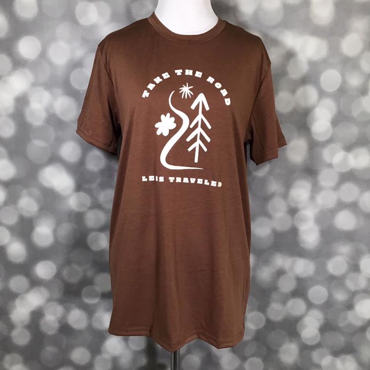 LuLaRoe Rocker T in brown with “Take the Road Less Traveled” nature graphic from the Great Outdoors Collection.