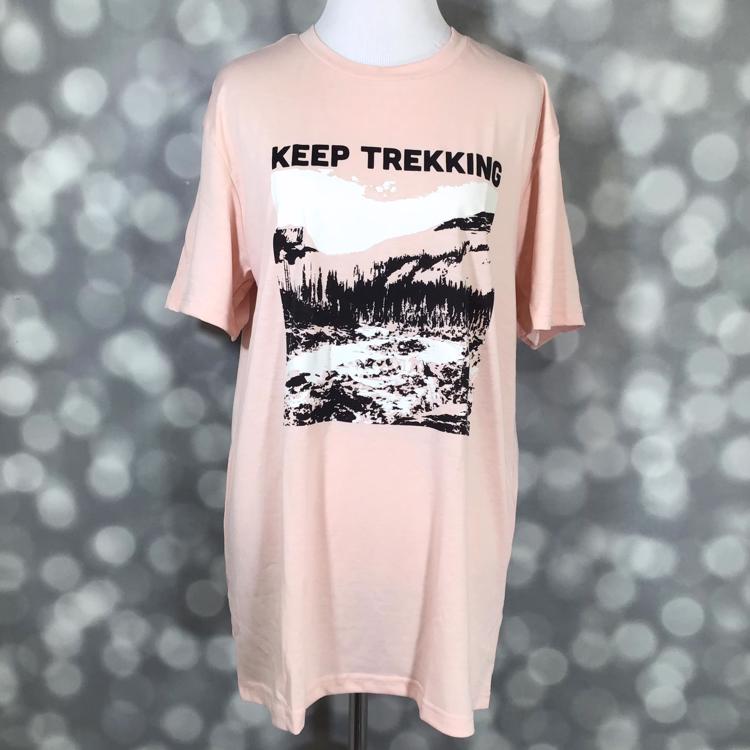 LuLaRoe Rocker T in blush pink featuring “Keep Trekking” mountain landscape graphic from the Great Outdoors Collection.
