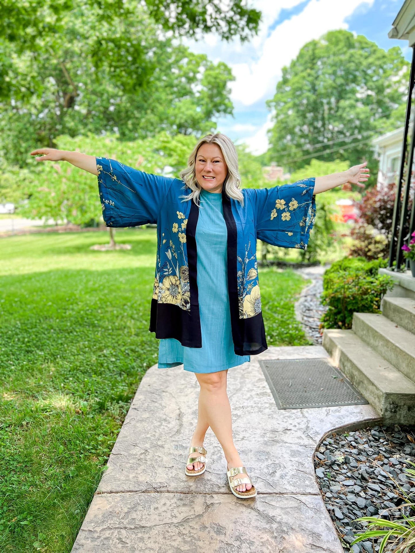 LuLaRoe Aurora bell sleeve kimono in a teal, yellow and black botanical floral print