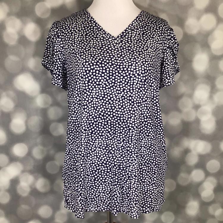 Career Remi navy white dense dot V-neck tulip-sleeve top in a modal blend.