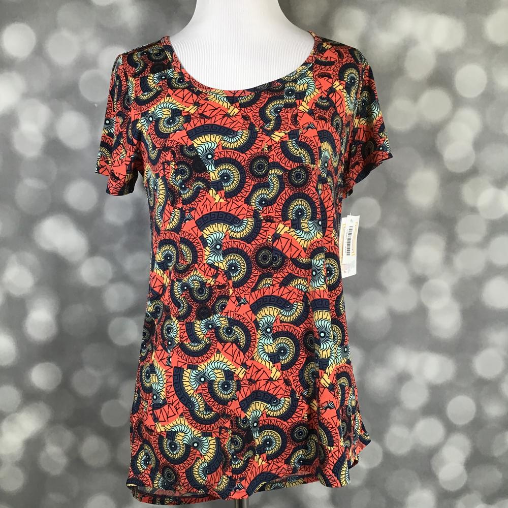 LuLaRoe Classic T coral orange navy teal abstract tribal swirls print on a short sleeve scoop neck relaxed A-line tee