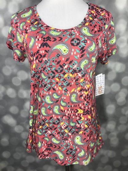 LuLaRoe Classic T dusty rose lime green teal ornate paisley print on a short sleeve scoop neck relaxed A-line tee