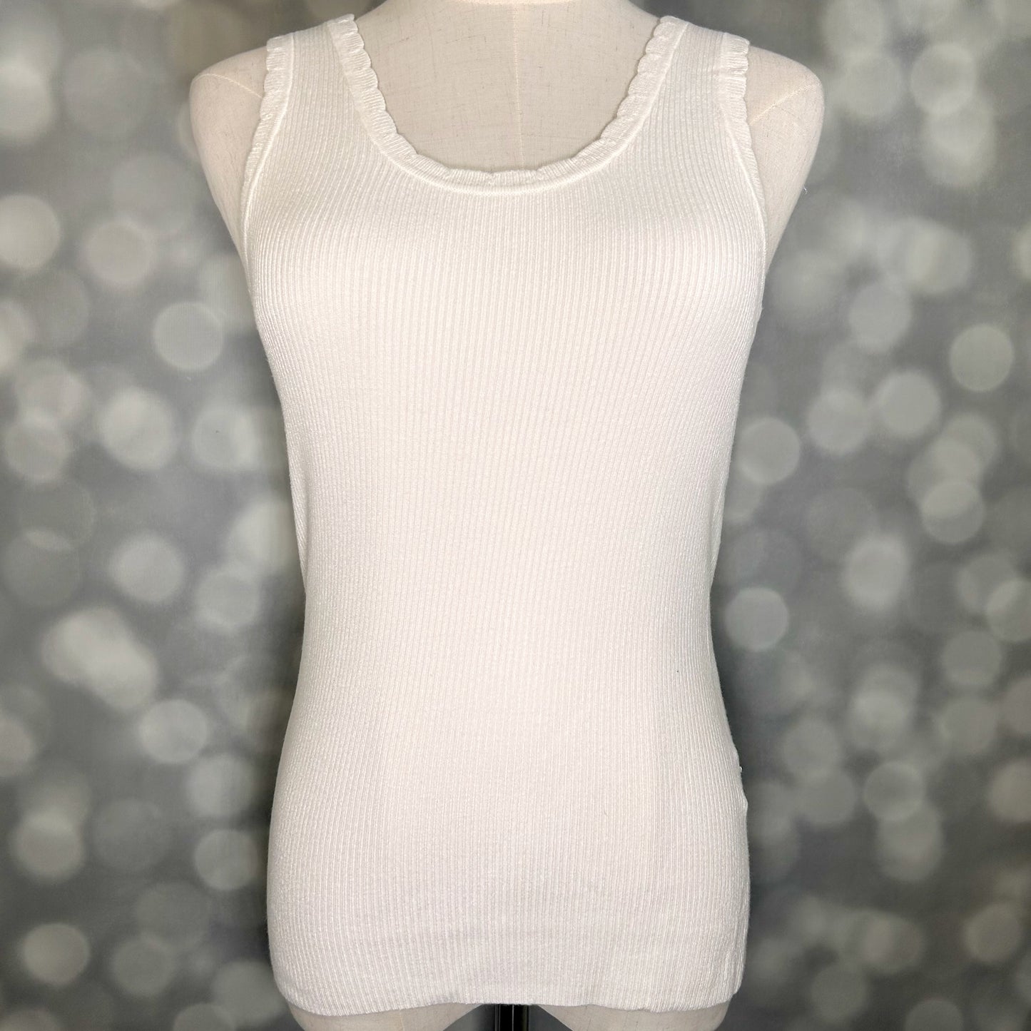 LuLaRoe Maydene Scallop Edge Tank in Solid White with rib knit fabric, fitted silhouette, and scalloped neckline and arm openings. Alternate product image.