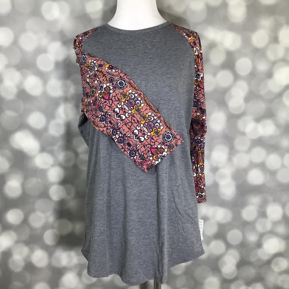 LuLaRoe Randy Tee in Autumn Wildflower featuring a heather charcoal gray body with dusty mauve raglan sleeves printed with mustard, plum, ivory, and charcoal floral designs in size Large.