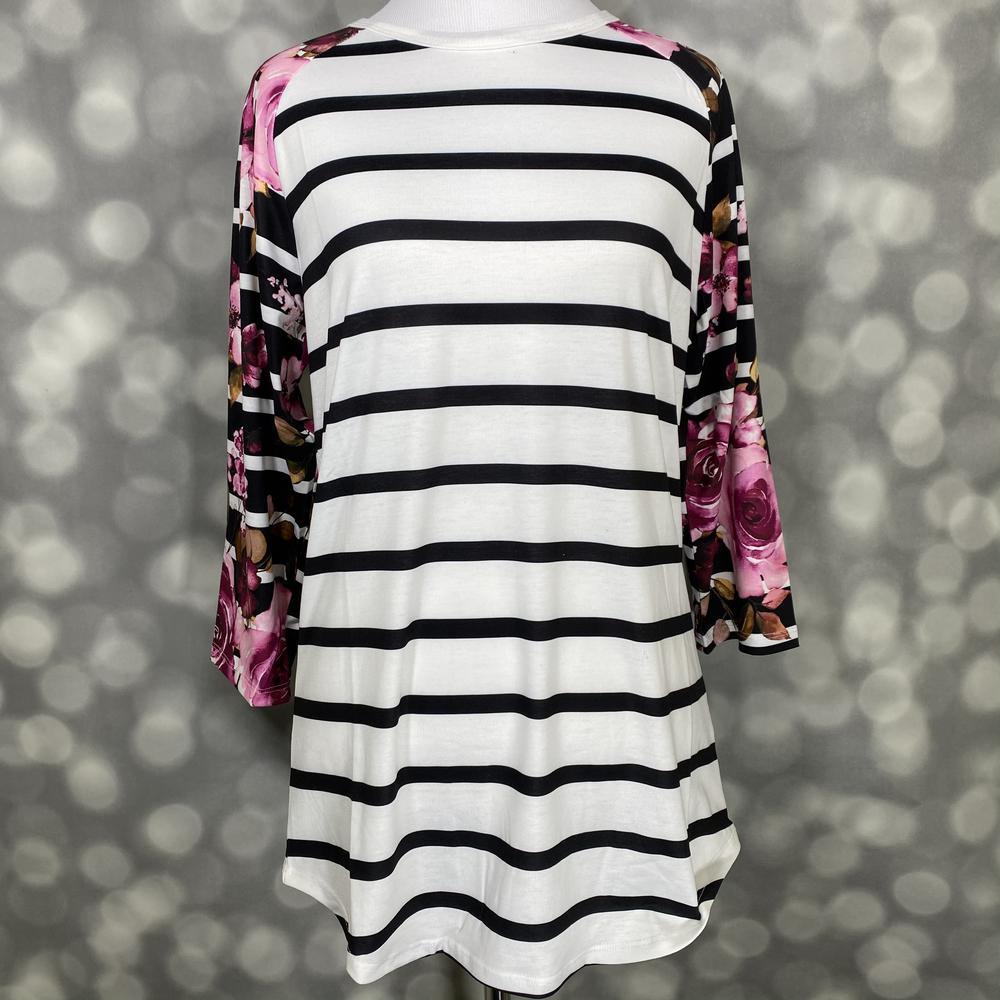LuLaRoe Randy Tee in Midnight Rose Stripe featuring an ivory body with black horizontal stripes and black raglan sleeves printed with magenta and blush roses in size XL.