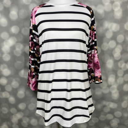 LuLaRoe Randy Tee in Midnight Rose Stripe featuring an ivory body with black horizontal stripes and black raglan sleeves printed with magenta and blush roses in size XL.