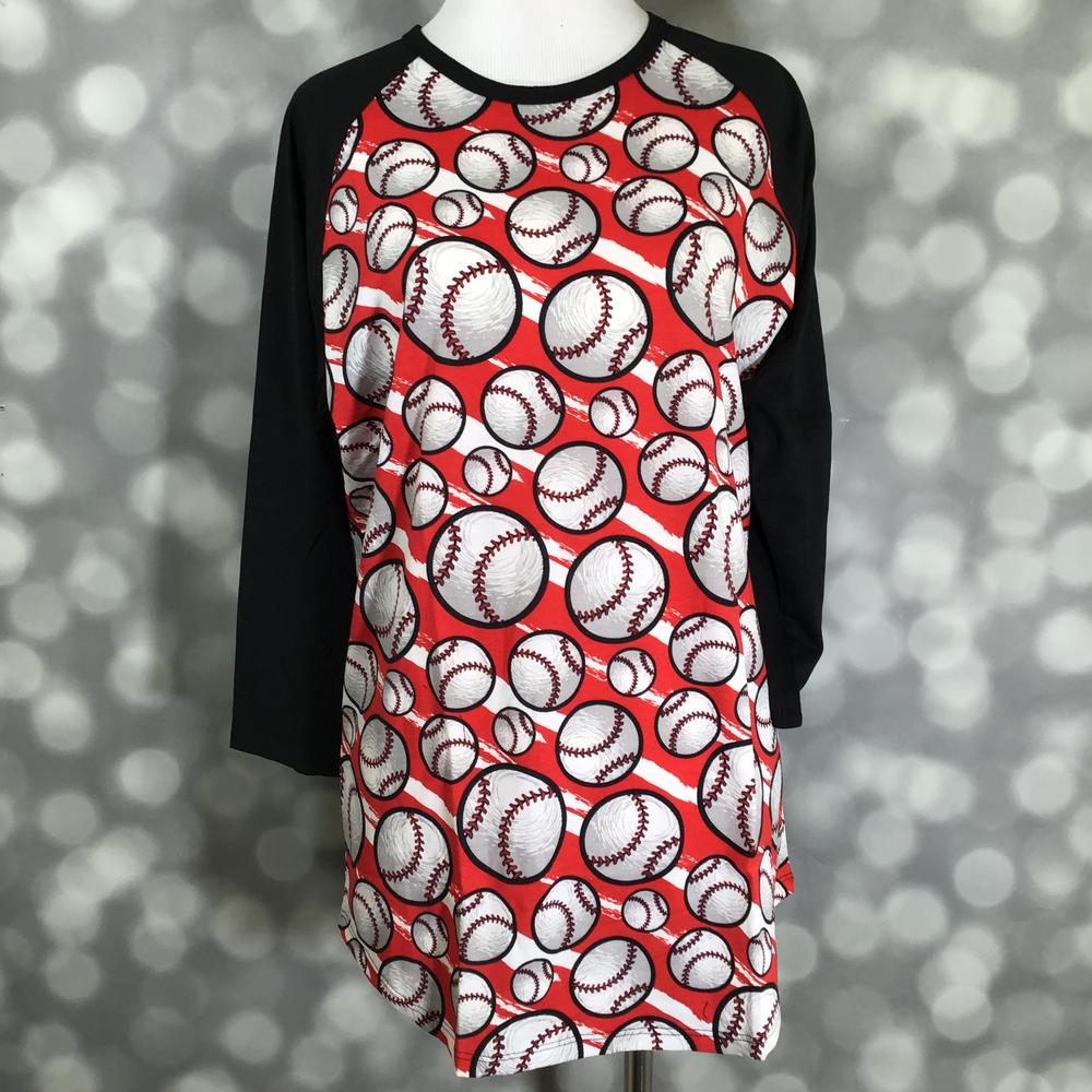 LuLaRoe Randy Tee in Home Run Baseball featuring an all-over baseball print on a bright red background with black 3/4 raglan sleeves in size Large.