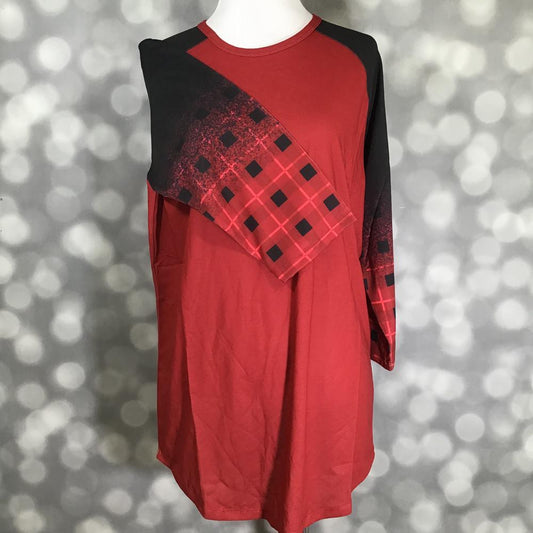 LuLaRoe Randy Tee in Crimson Shadow Plaid featuring a rich crimson red body with black raglan sleeves printed in a distressed crimson and black buffalo plaid design in size Large.