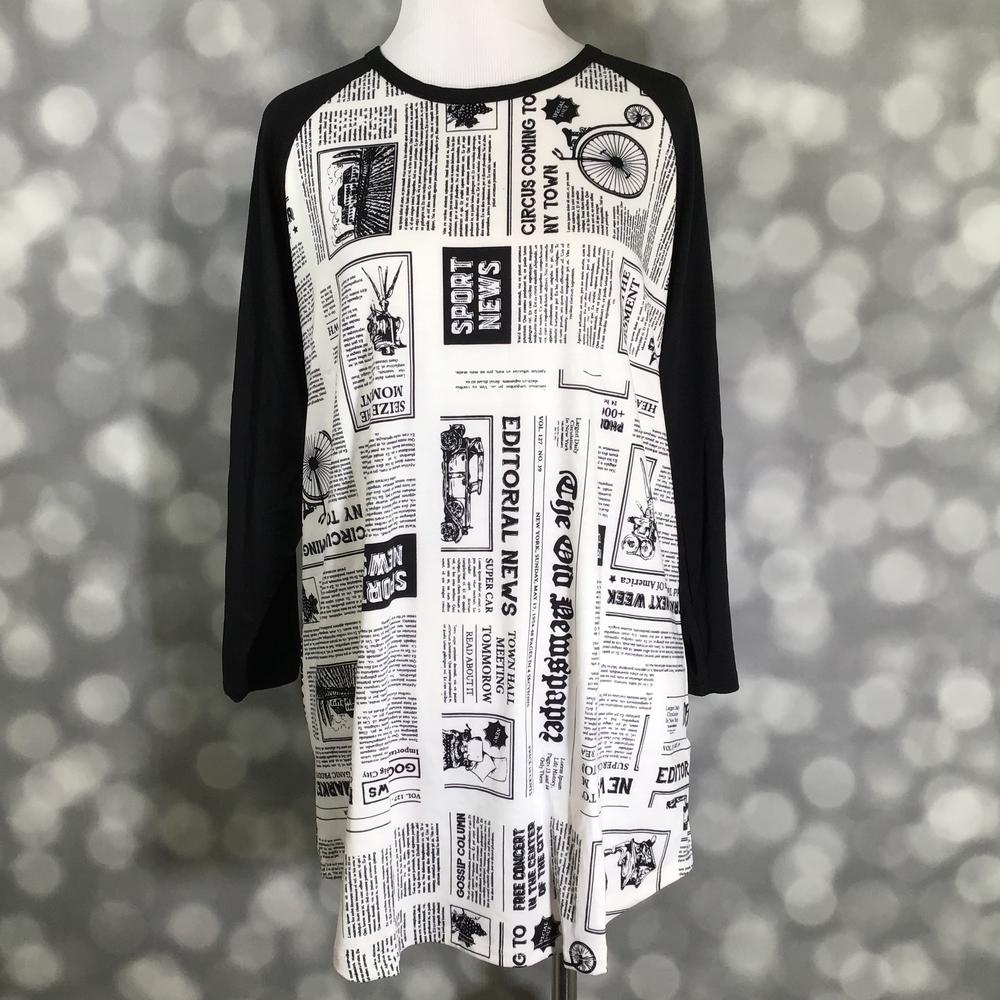 LuLaRoe Randy Tee in Vintage Press featuring a black-and-white vintage newspaper collage print with black 3/4 raglan sleeves in size XL.