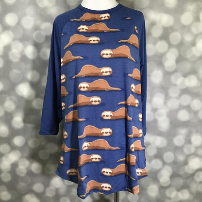 LuLaRoe Randy Tee in Sleepy Sloths featuring an all-over lounging sloth print on a cobalt blue background with matching blue 3/4 raglan sleeves in size XL.