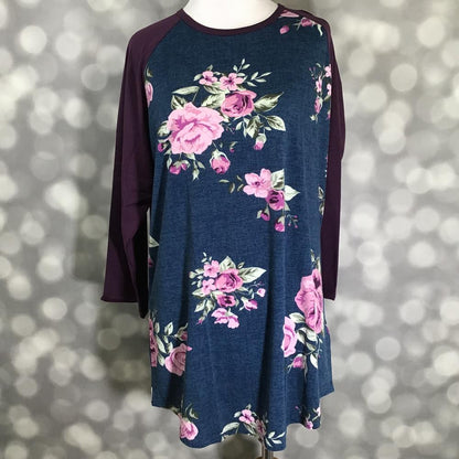 LuLaRoe Randy Tee in Plum Rose Bouquet featuring pink and mauve rose bouquets on a heathered navy background with rich plum 3/4 raglan sleeves in size XL.