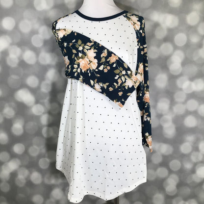 LuLaRoe Randy Tee in Midnight Rose Garden featuring an ivory body with black polka dots and navy raglan sleeves with blush and ivory floral prints in size Medium.