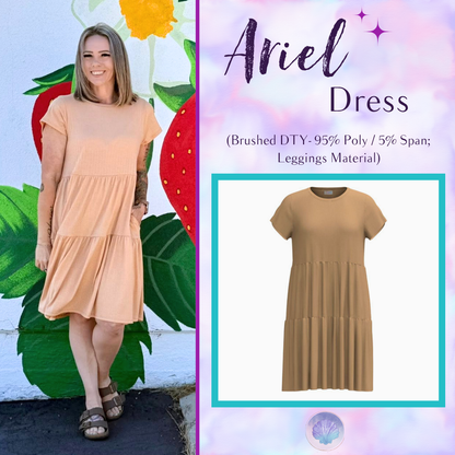 Woman wearing LuLaRoe Ariel Tiered Dress in Solid Warm Apricot, a soft peach beige tiered short dress with relaxed fit, flowy silhouette, and feminine casual styling for spring and summer.