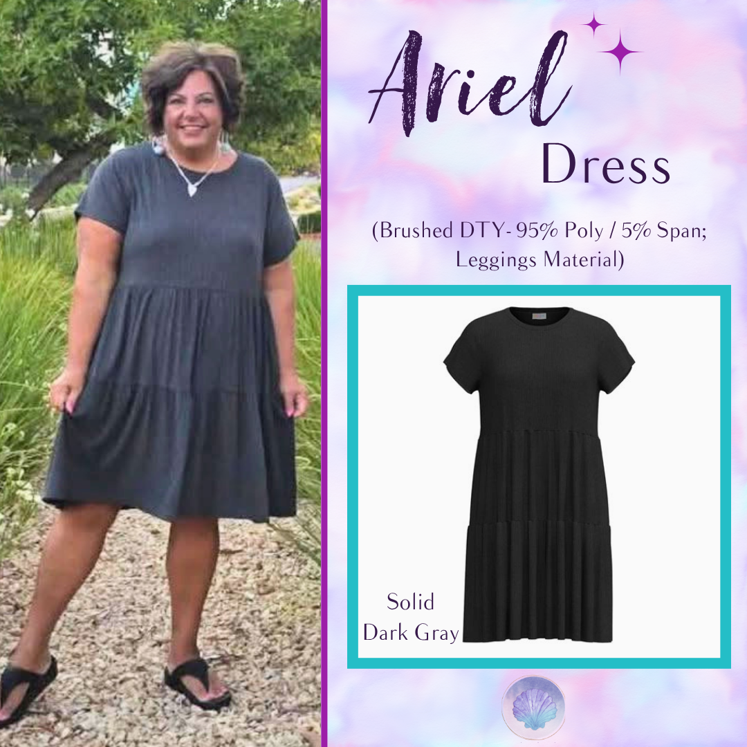 Woman wearing LuLaRoe Ariel Tiered Dress in Solid Deep Charcoal, a rich charcoal gray tiered short dress with relaxed fit, flowy silhouette, and soft stretch comfort for everyday wear.
