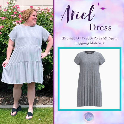 Woman wearing LuLaRoe Ariel Tiered Dress in Solid Heather Silver, a soft heather gray tiered short dress with relaxed fit, flowy silhouette, and comfortable stretch fabric for everyday style.
