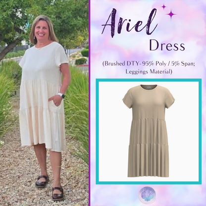 Woman wearing LuLaRoe Ariel Tiered Dress in Solid Soft Ivory, a soft ivory cream tiered short dress with relaxed fit, flowy silhouette, and comfortable stretch fabric for effortless everyday style.