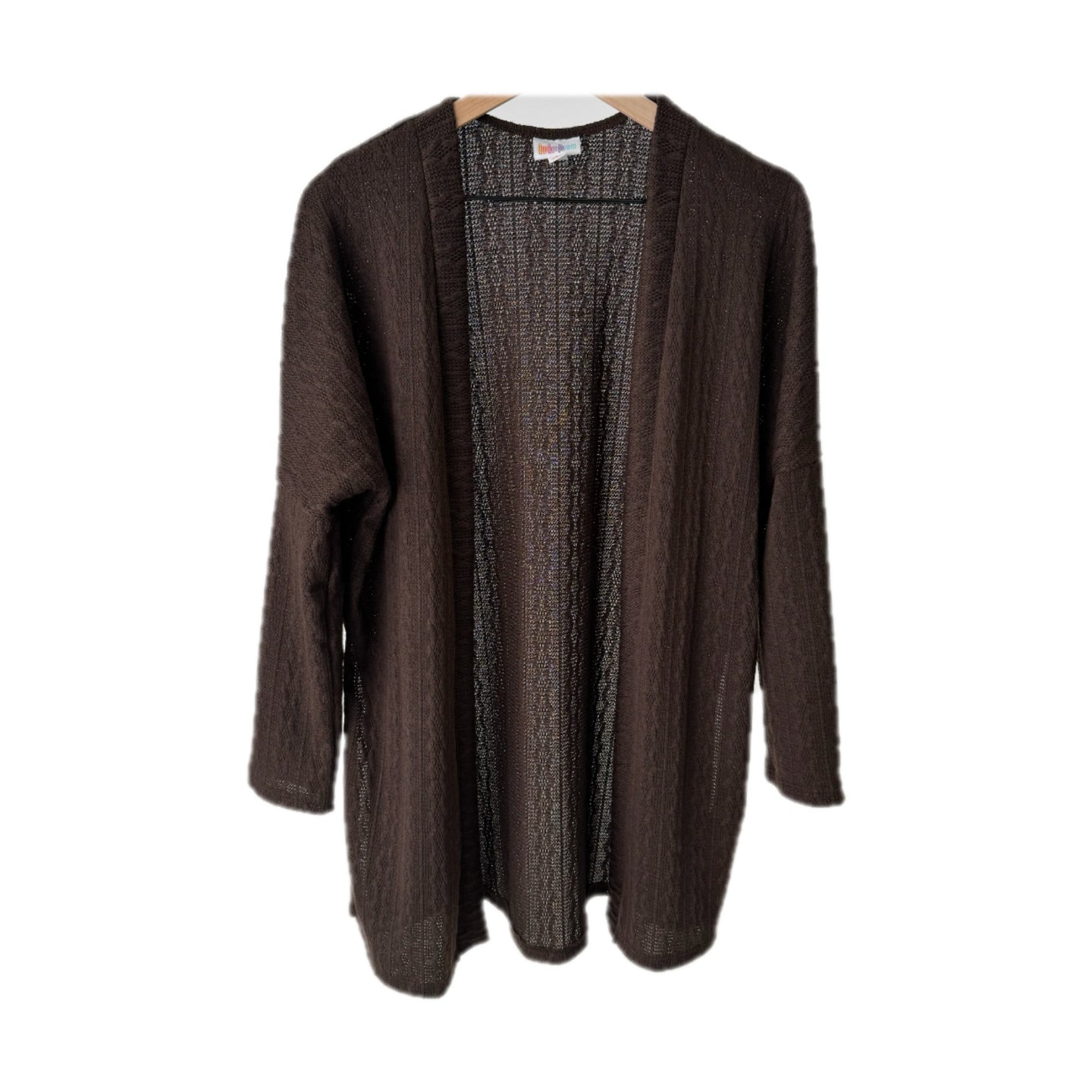 LuLaRoe Connie Lightweight Overlay in Solid Chocolate Brown featuring a lightweight cable knit texture, open front cardigan, relaxed fit, and long sleeves layered over a white ribbed tank.