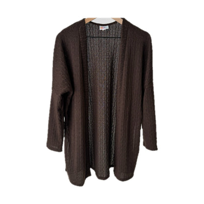 LuLaRoe Connie Lightweight Overlay in Solid Chocolate Brown featuring a lightweight cable knit texture, open front cardigan, relaxed fit, and long sleeves layered over a white ribbed tank.