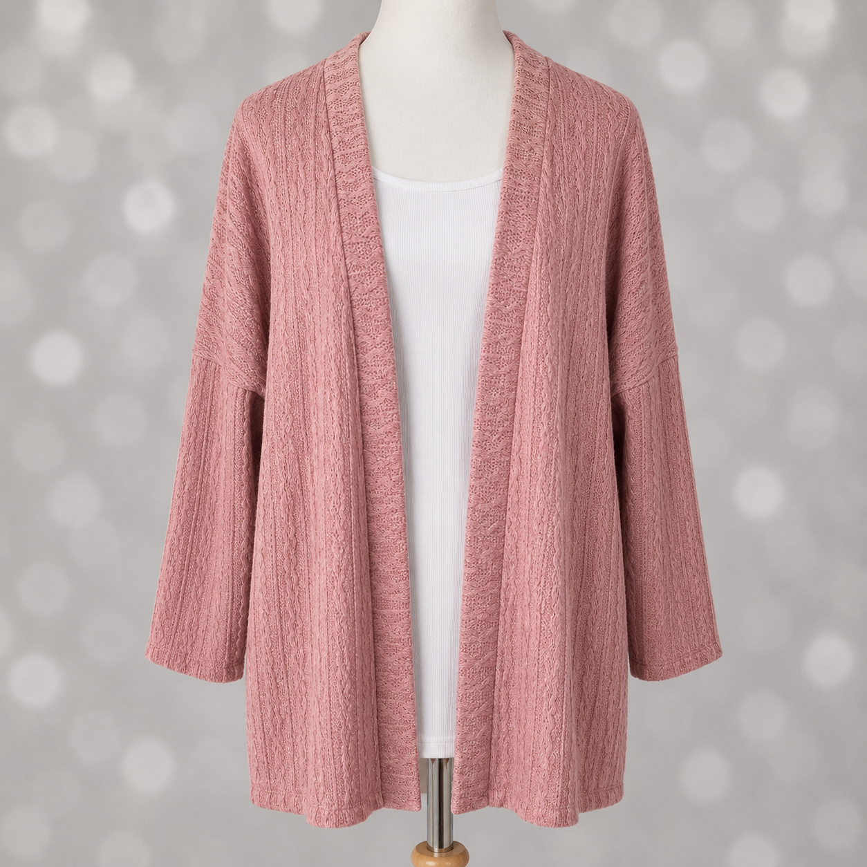 LuLaRoe Connie Lightweight Overlay in Solid Dusty Rose featuring a lightweight cable knit texture, open front cardigan, relaxed fit, and long sleeves layered over a white ribbed tank.