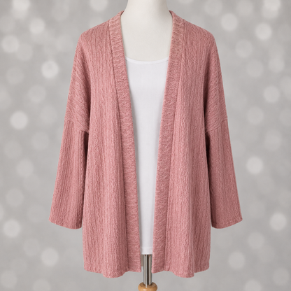 LuLaRoe Connie Lightweight Overlay in Solid Dusty Rose featuring a lightweight cable knit texture, open front cardigan, relaxed fit, and long sleeves layered over a white ribbed tank.