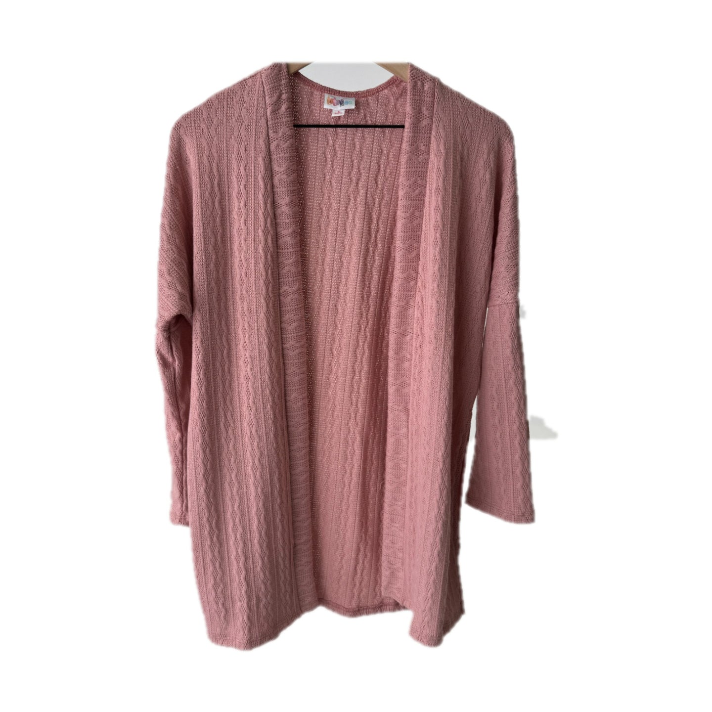 LuLaRoe Connie Lightweight Overlay in Solid Dusty Rose featuring a lightweight cable knit texture, open front cardigan, relaxed fit, and long sleeves layered over a white ribbed tank.