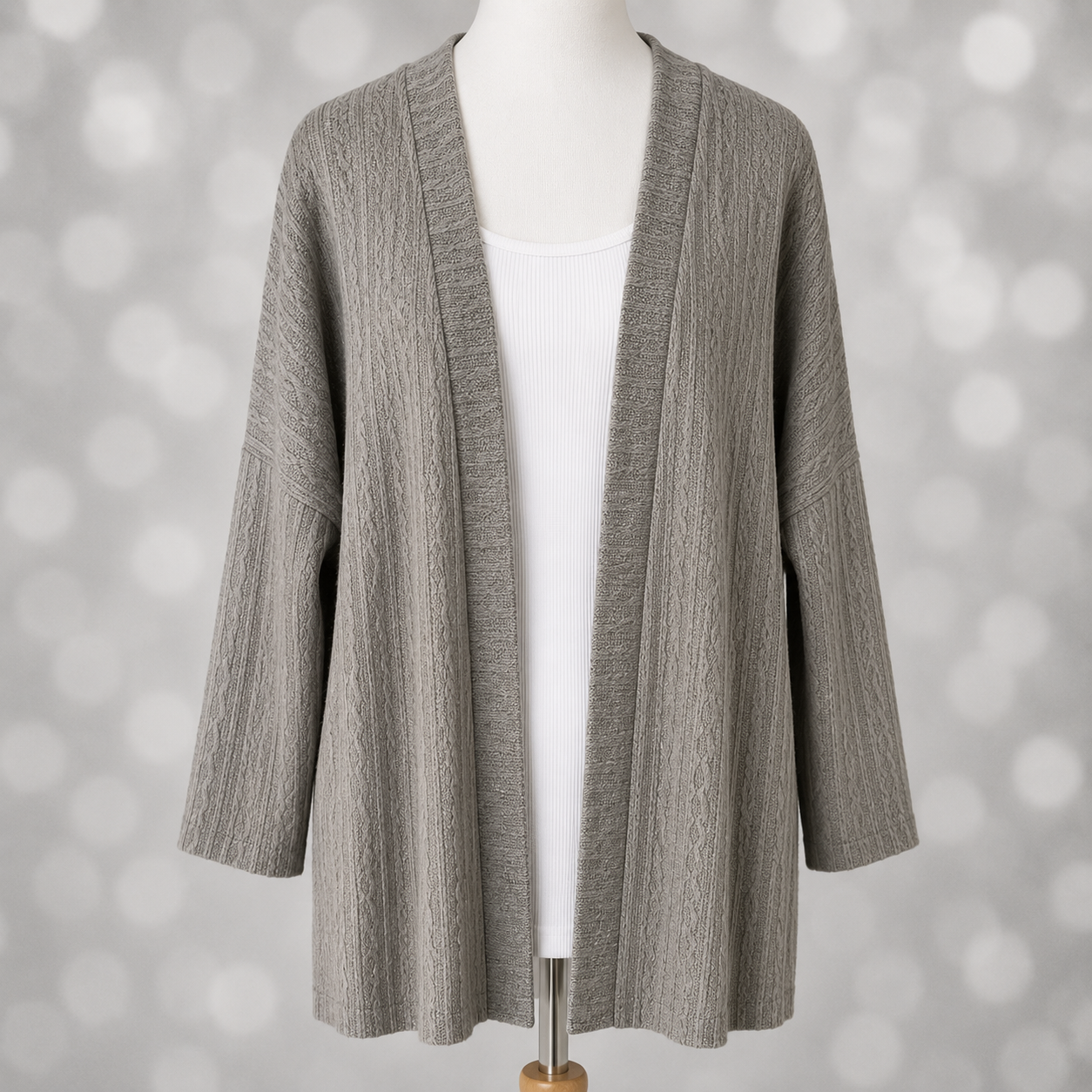 LuLaRoe Connie Lightweight Overlay in Solid Heather Gray featuring a lightweight cable knit texture, open front cardigan, relaxed fit, and long sleeves layered over a white ribbed tank.