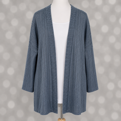 LuLaRoe Connie Lightweight Overlay in Solid Slate Blue featuring a lightweight cable knit texture, open front cardigan, relaxed fit, and long sleeves layered over a white ribbed tank.