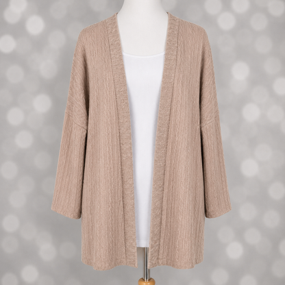 LuLaRoe Connie Lightweight Overlay in Solid Soft Blush featuring a lightweight cable knit texture, open front cardigan, relaxed fit, and long sleeves layered over a white ribbed tank.