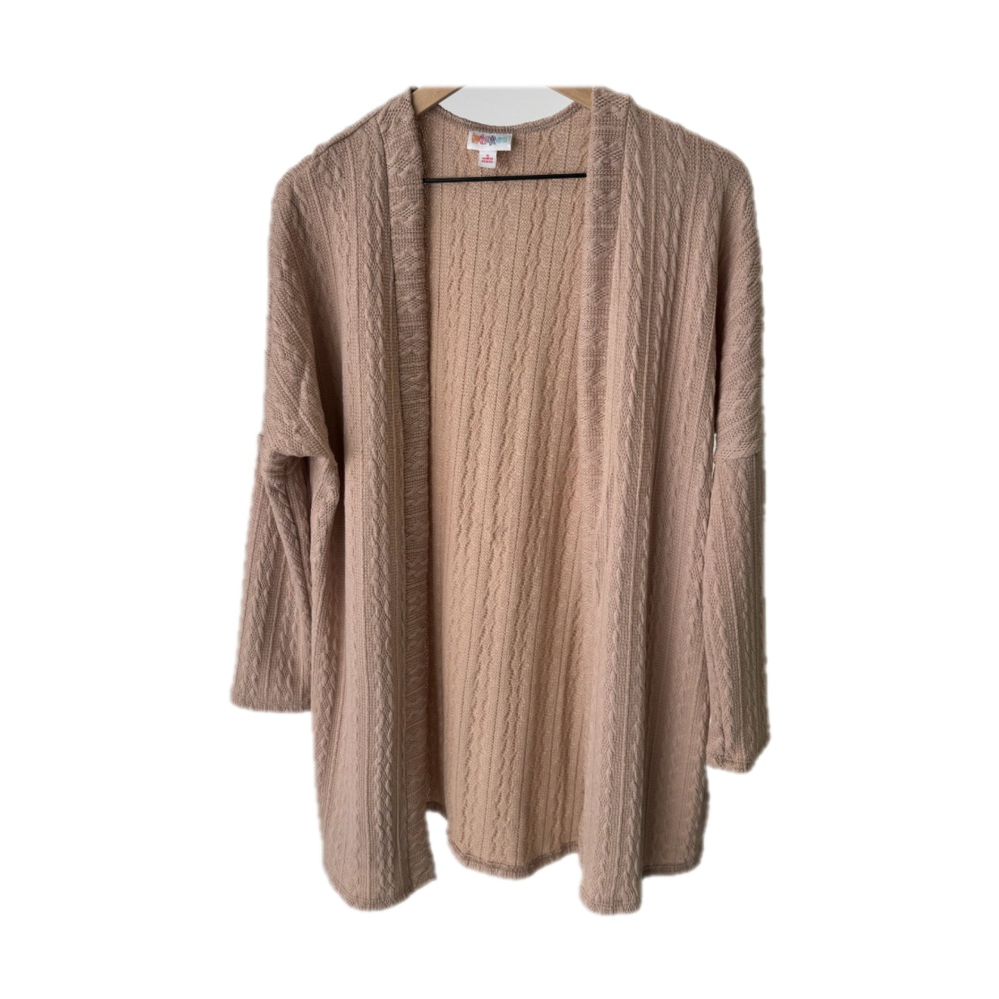 LuLaRoe Connie Lightweight Overlay in Solid Soft Blush featuring a lightweight cable knit texture, open front cardigan, relaxed fit, and long sleeves layered over a white ribbed tank.