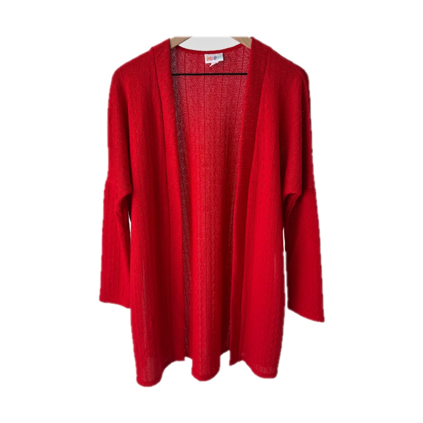 LuLaRoe Connie Lightweight Overlay in Solid True Red featuring a lightweight cable knit texture, open front cardigan, relaxed fit, and long sleeves layered over a white ribbed tank.