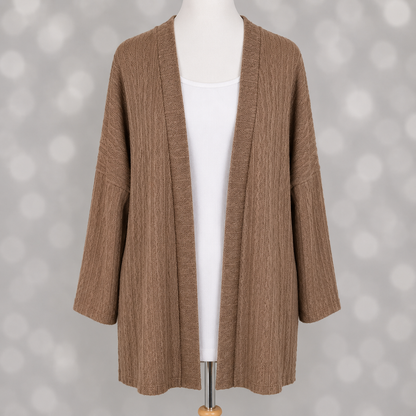 LuLaRoe Connie Lightweight Overlay in Solid Warm Caramel featuring a lightweight cable knit texture, open front cardigan, relaxed fit, and long sleeves layered over a white ribbed tank.