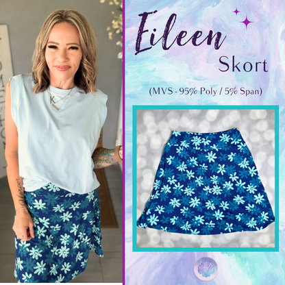 LuLaRoe Eileen Skort in Navy and Teal Daisy Floral shown styled on a model and laid flat with layered blue daisies and a flared silhouette
