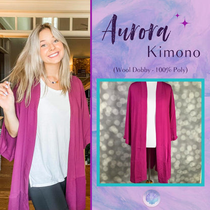 LuLaRoe Aurora Kimono in solid magenta pink displayed on a mannequin against a soft bokeh background. Lightweight open-front kimono with wide sleeves in drapey Wool Dobby fabric.