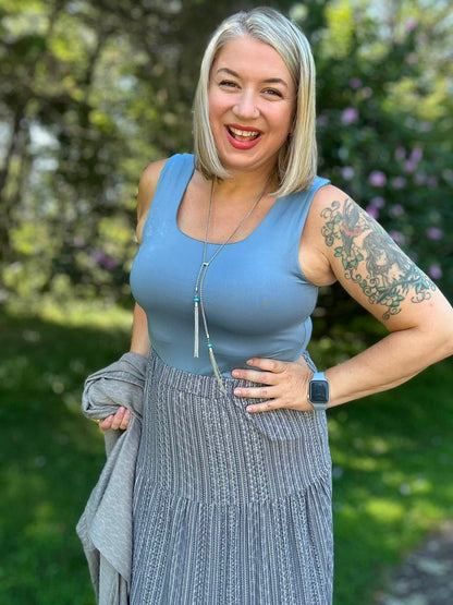 Model wearing the LuLaRoe Robyn Fitted Tank in solid slate blue