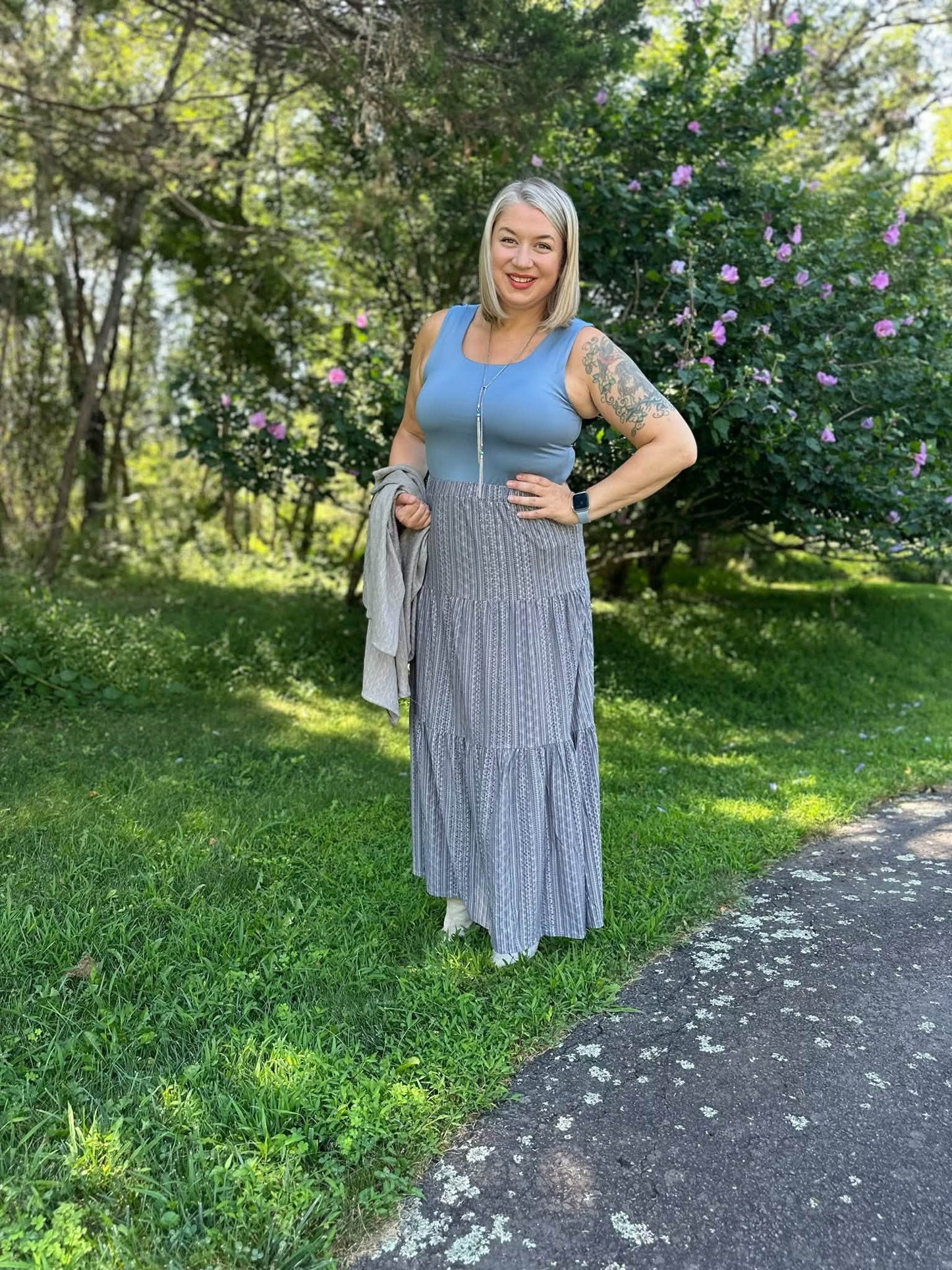 Model wearing the LuLaRoe Robyn Fitted Tank in solid slate blue