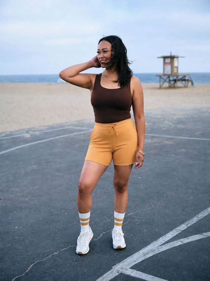 Model wearing the LuLaRoe Robyn Fitted Tank in solid espresso brown